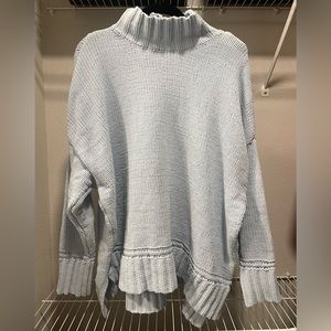 light blue mock-neck soft knit sweater